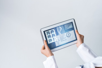 Close of female doctor hands working with tablet pc computer