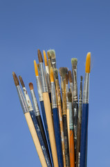 painting brushes on blue background