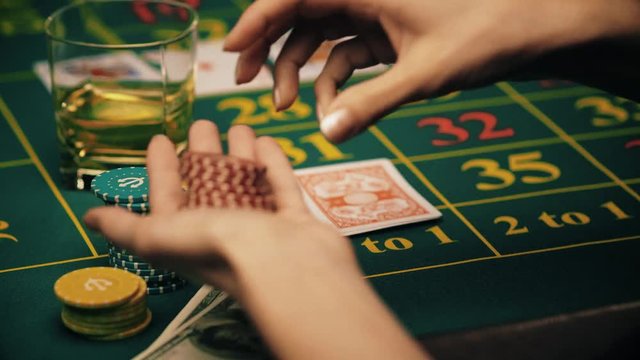 girl plays poker and makes a bet