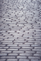 Cobblestone that is worn and weathered in Stockholm old town