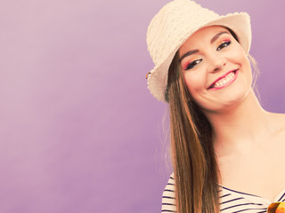 Happy cute tourist girl in straw hat.