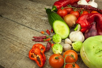 Fresh vegetables on an old wooden table. Preparing vegetarian food. Diet Food. Sales of vegetables.