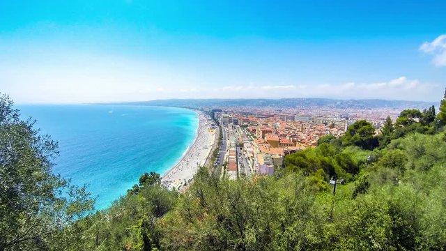 Beautiful panoramic aerial view of beach in City of Nice in sunny summer day. Cote d'Azure, France. City of Nice is a famous and luxury resort of French riviera. Time Lapse. 4K UltraHD
