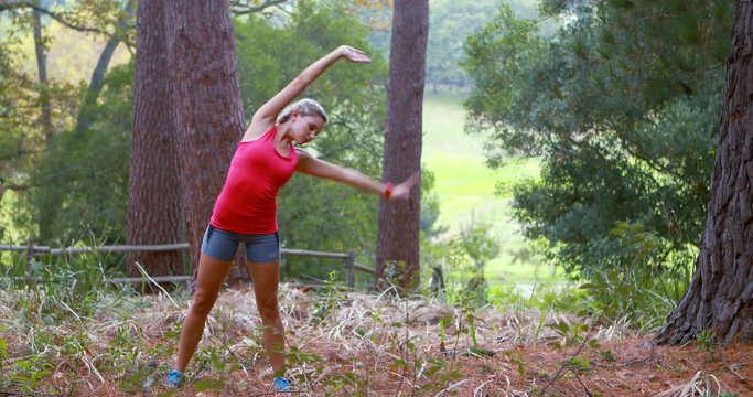 Woman exercising in forest