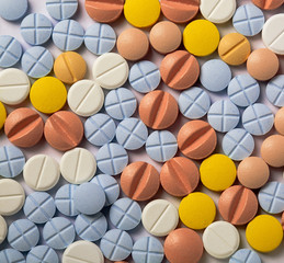 many pills white yellow blue red health