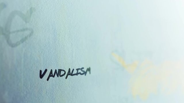 Vandalism Graffiti Tag Signature on dreary suburban outside wall