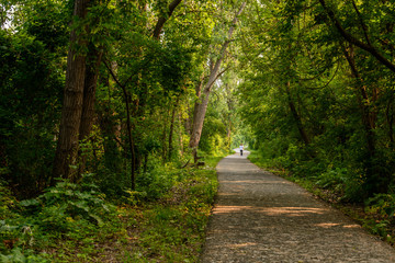 Woman walking on path - horizontal