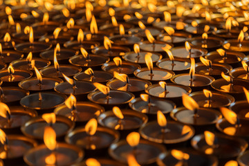 Obraz premium Lighting a lamp for peace from Shree Boudhanath Kathmandu ,Nepal.