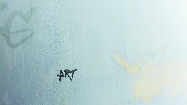 Art Graffiti Tag Signature on dreary suburban outside wall