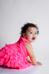 Adorable Baby Girl Looking Over Her Shoulder