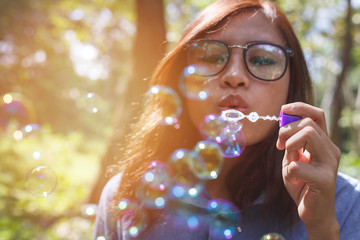 Asia woman Playing blowing balloons at the Park