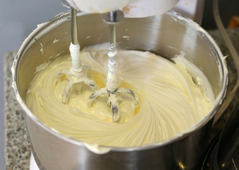 Making of a cream for home-made cakes on a mixer
