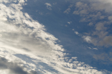 Obraz premium Cumulus clouds against a blue sky. Overcast. Weather forecast.