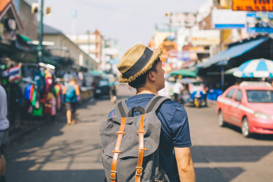 Young Asian Traveling Backpacker In Khaosan Road Outdoor Market