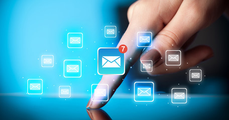 Fingers touching tablet with mail