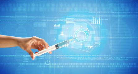 Female doctor holding syringe