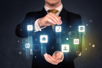 Businessman holding blue applications