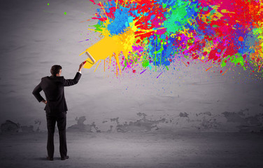 Sales person painting colorful splatter