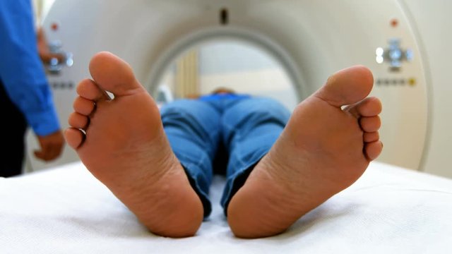 A patient is loaded into an mri machine