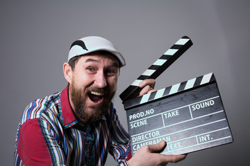 Smiling man with clapper movie