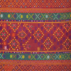 colorful thai silk handcraft peruvian style rug surface old vintage torn conservation Made from natural materials Chemical free close up silk background silk texture