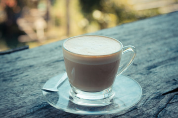 cup of latte coffee on wood table