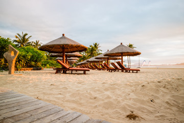 Relaxation at the beach in a wooden armchair