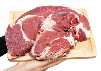 meat on a board on a white background