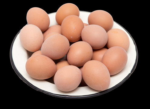 boiled eggs in a bowl on a black background