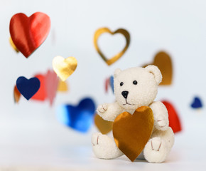 Teddy bear Valentines Day. Studio shot on a white with hearts.