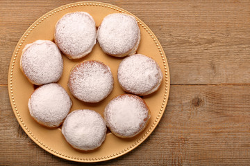 Fototapeta na wymiar Traditional Polish donuts with liqueur and sugar