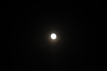 Moon over dark black sky at night