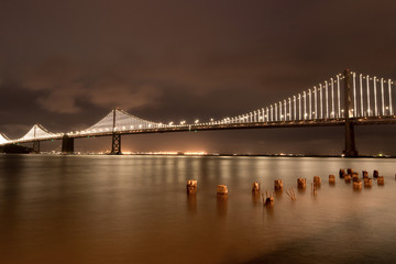Naklejka na ściany i meble San Francisco-Oakland Bay Bridge At Night From The Embarcadero