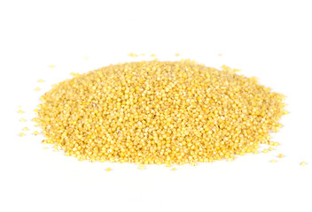 Yellow millet seeds on the white background