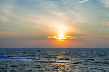 Sunset on tropical coastline