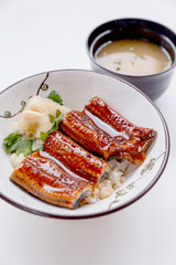 Unadon (Japanese Rice Bowl Topping with Grilled Japanese Freshwater Eel with Teriyaki Sauce) Served with Prickled Ginger.