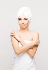 Young, beautiful woman wrapped in a towel