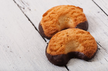 Tasty baked cookies on old wooden background.