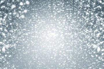 Snowflakes  and bokeh or glitter lights on silver background. Christmas abstract template