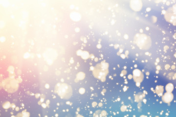 Fototapeta na wymiar Magic Festive blue background. Golden bokeh light and red sun. Christmas glitter lights