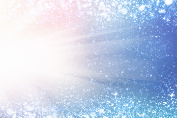 Magic Festive blue background. Bokeh light and sun. Christmas glitter lights