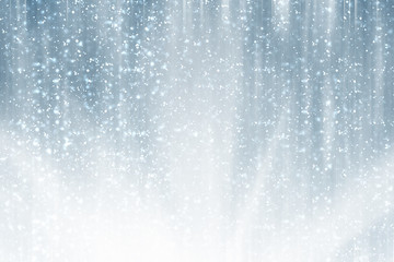 Snowflakes particles and bokeh or glitter lights on silver background .Festive abstract template