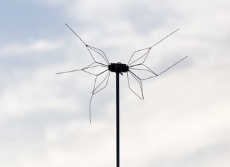 TV antenna on sky background