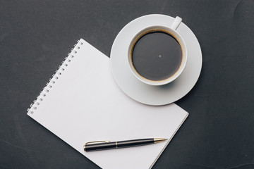 a cup of tea and a notebook, top view