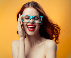 woman in glasses on a Orange background, a woman with glasses, woman