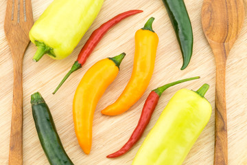 Chili peppers in wooden plate.