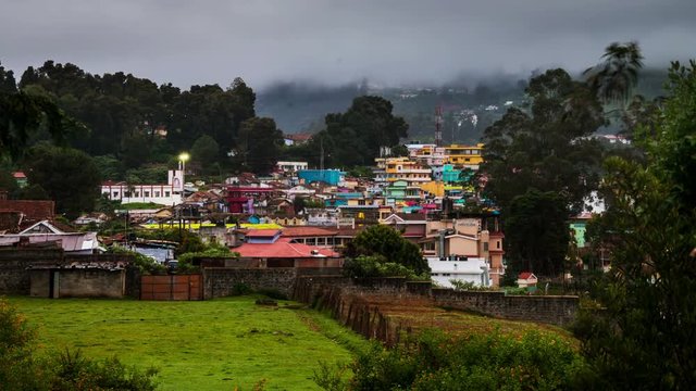 Ooty, India time-lapse from night to day. Aerial view of Nilgiri mountain village in Tamil Nadu, India. Ooty is a popular resort with beautiful nature