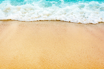 Waves crashing into the sand