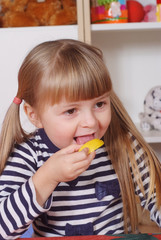 Three-year girl playing and learning in preschool