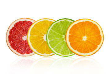 Pieces of grapefruit, lemon, lime, orange isolated on white background